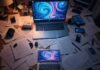 AI Animation Apps: Turn Boring Videos Into Art "Overhead view of a cluttered desk with a laptop showing vibrant AI art swirls, surrounded by papers and a coffee mug, in a dimly lit room, 1:1 ratio."