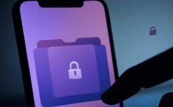 How to Hide Photos and Videos Safely on Android Devices: Your Privacy Guide Alt text: Slightly blurred smartphone screen with a locked folder icon, a hand shadow shielding it, faint digital glitch background, and a tiny pixelated padlock, featuring muted purples, deep blues, and neon green accents.